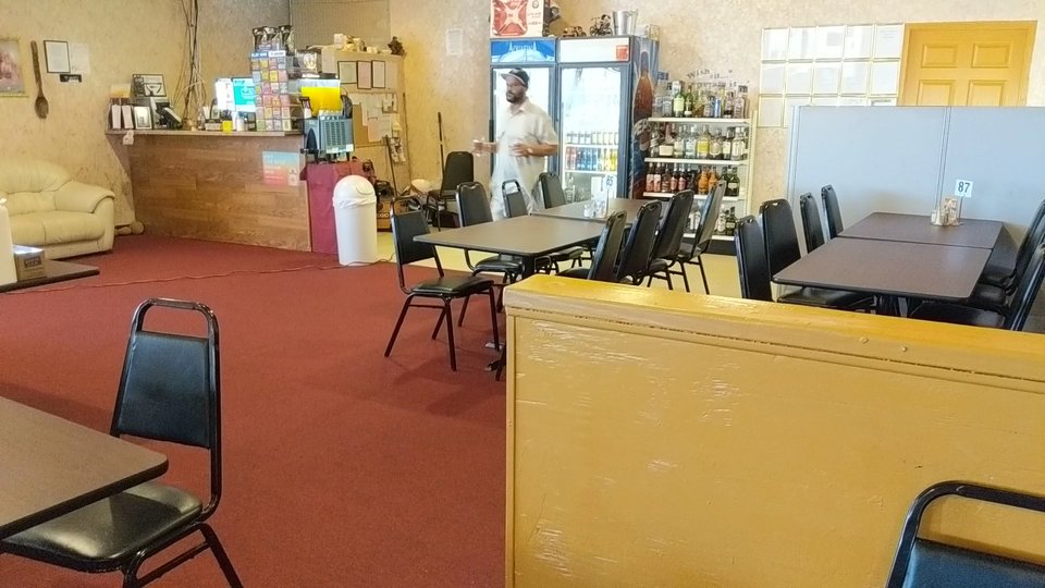 Restaurant dining room with simple decor.